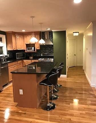 Kitchen on the second floor. This photo also shows the hallway to 3 bedrooms.