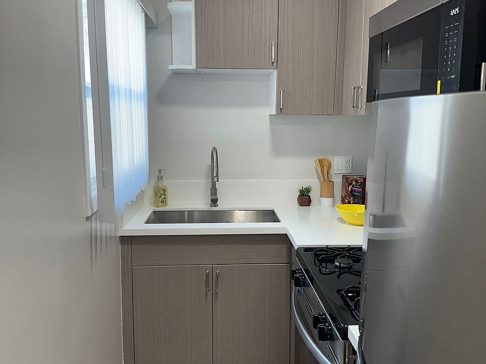 all new kitchen with microwave, stove and refrigerator