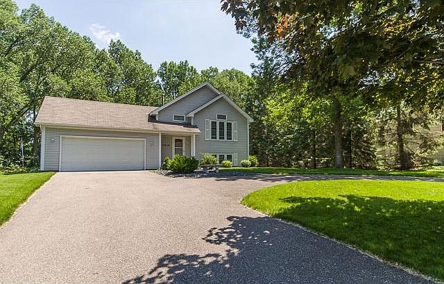 Gorgeous home on Shingle Creek located on a 1/2 acre cul-de-sac landscaped lot with a Circular drive