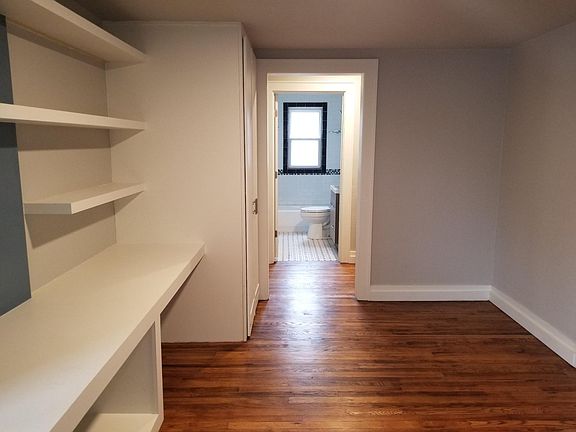 Looking towards the bathroom from the dining room/study room.