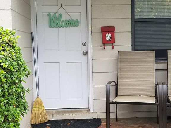 Front porch/stoop, was pressure washed and door painted since this photo.
