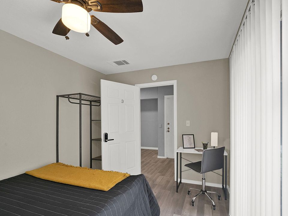 Room 3 with queen sized bed, workspace and wardrobe