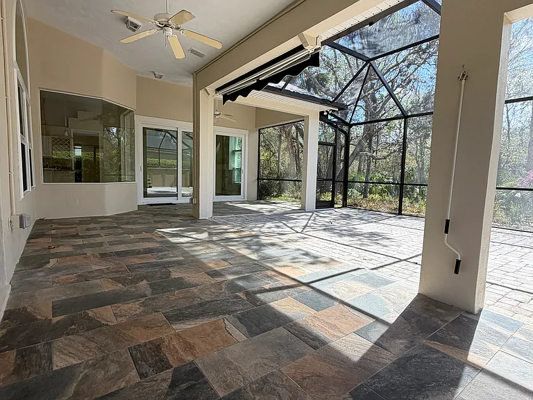 Covered & Screened Lanai overlooks private backyard and preserve.