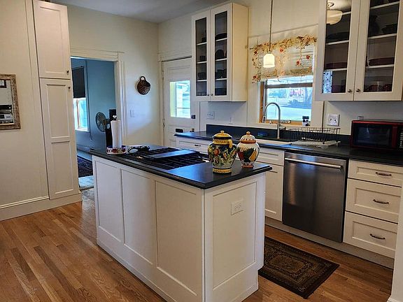 Kitchen Area With Hardwood Flooring , Stainless Steel Dishwasher, Refrigerator And Counter Mount Gas Stove. Private Entrance Into Unit
