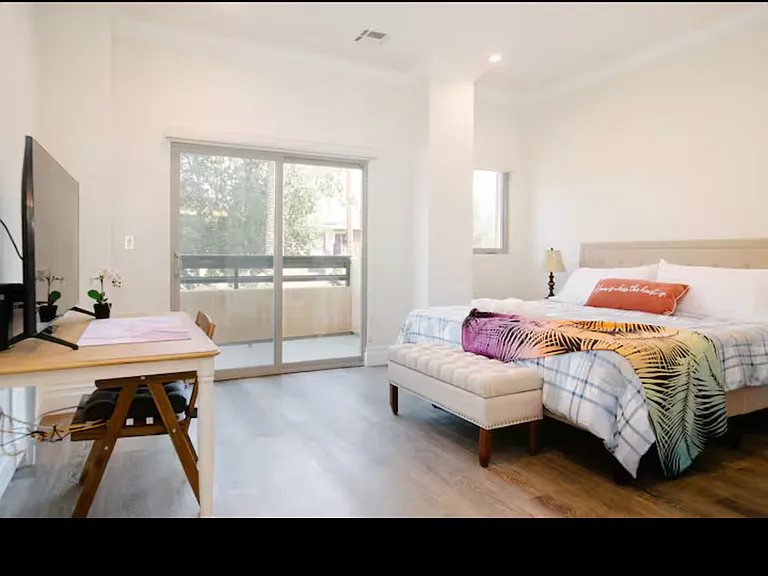 Upstairs master bedroom with a balcony