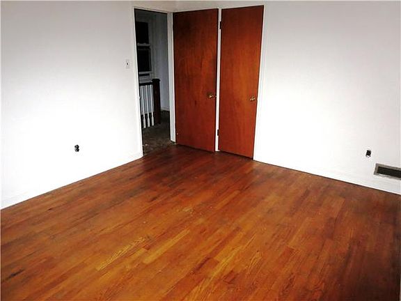 Master bedroom with hardwoods