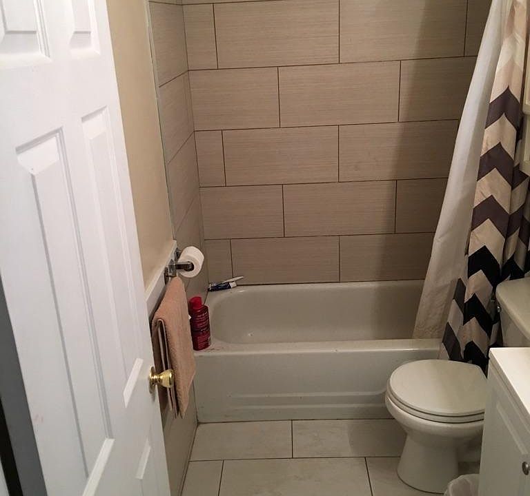 All new porcelain tile in bathroom
