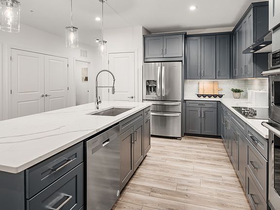 Quartz Countertops and Gray Cabinetry in the Gourmet Kitchen
