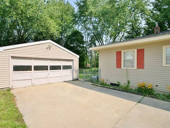 The two car garage has a workshop and an additional room in the back that is heated. It can be used as a man cave or more storage. A great place for a year round workshop! A newer roof and vinyl siding have been installed on the home among other updates. 