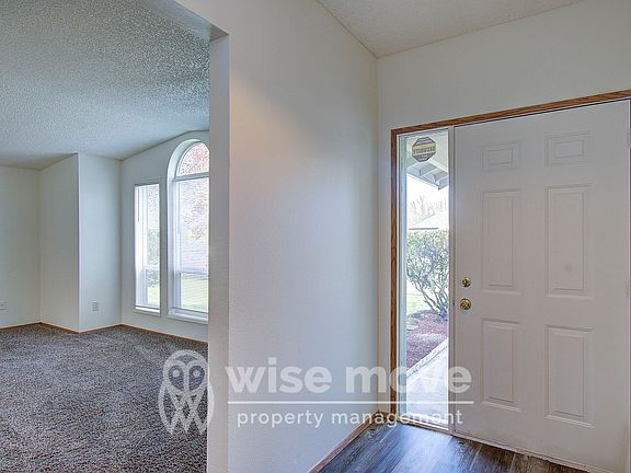 Entryway with living room to left
