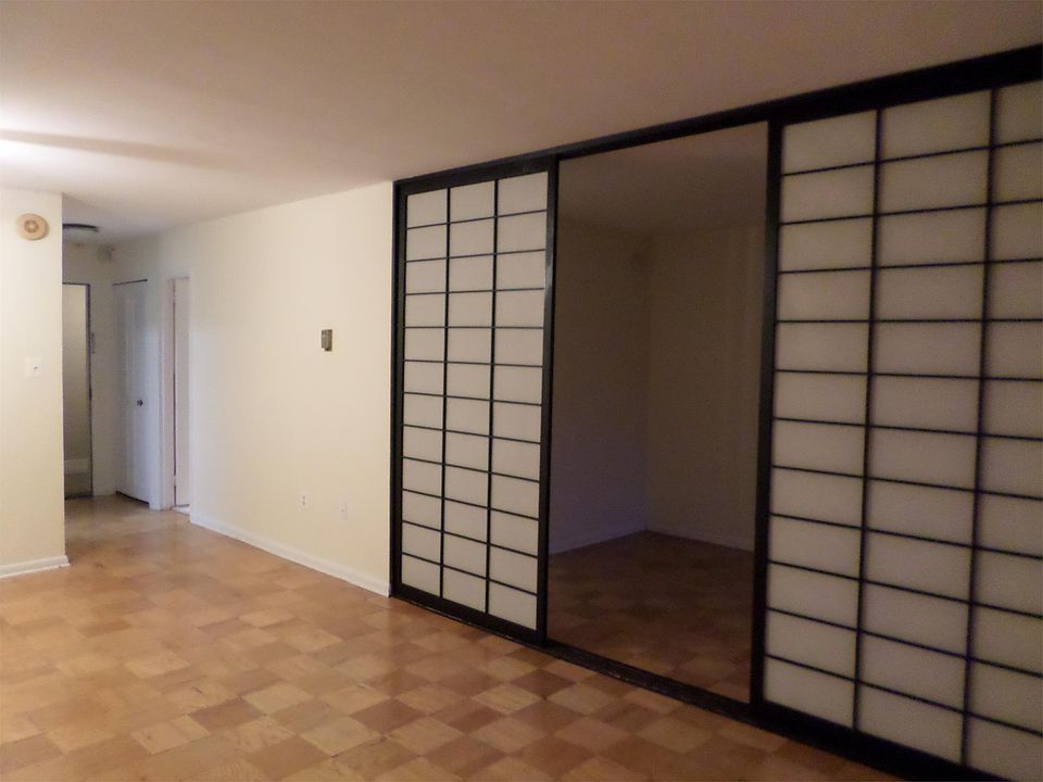 Unit entrance and division between bedroom and living area