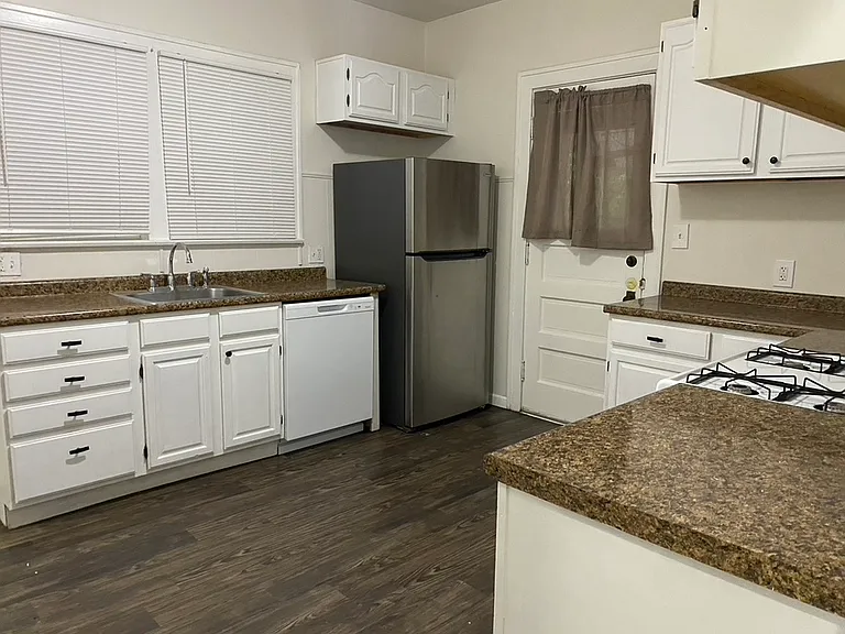 Kitchen with Refigerator, Dishwasher , and Stove Top