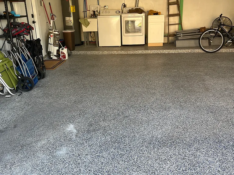 Garage with parking, bikes,beach wagon, chairs, umbrella and beach toys