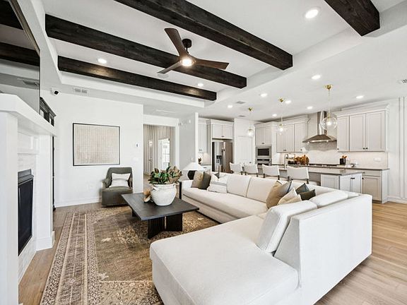 Open concept living area with optional beams