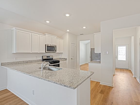 The spacious kitchen is perfect for preparing your family s favorite meals and treats.