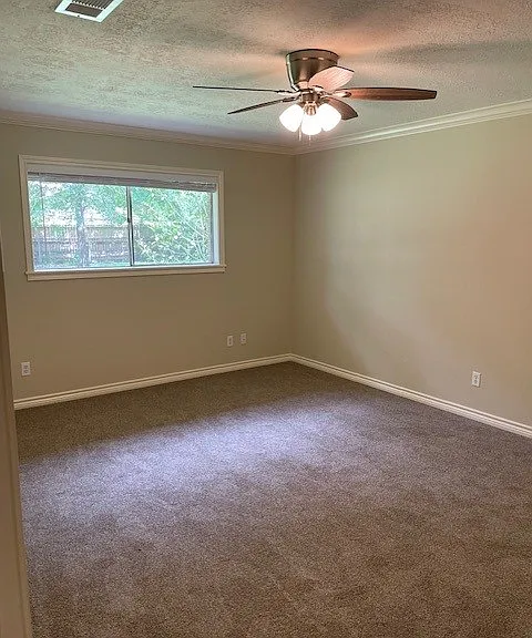 Master bedroom with 2 closets. All windows except the large bay one have wide slat plantation blinds.