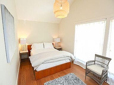 Queen size bed with linens