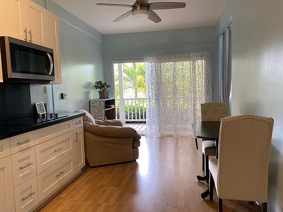 Expandable dining table and two linen covered high back dining chairs. Extra comfy micro suede loveseat and ottoman.