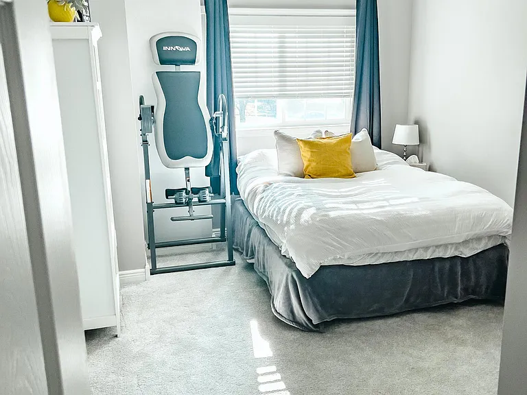 2nd bedroom with room for guest bed and home office.