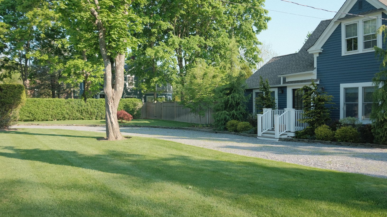  Set way back with a circular driveway, ample additional parking and a two car garage