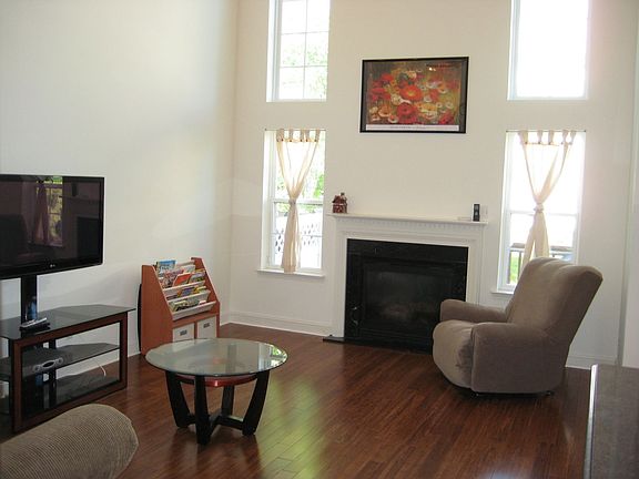 Sunny Two-Story Family Room with Fireplace