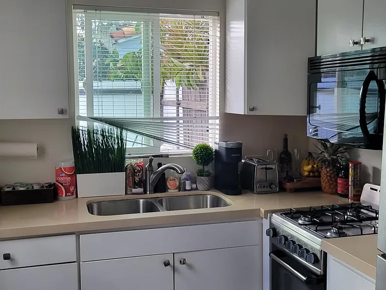 View of the Kitchen with your private yard showing through the kitchen window