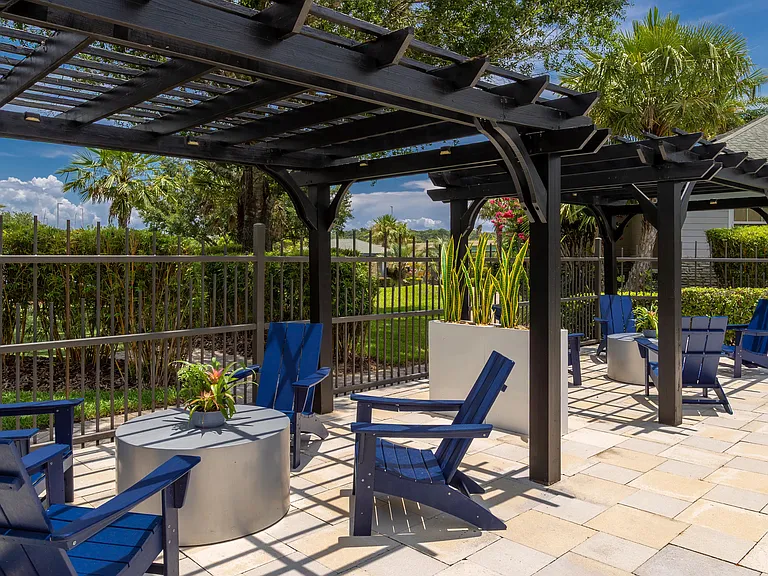 Unwind in the shade under our stylish pergolasperfect for casual conversations, poolside reading, or soaking up the serene Florida breeze.