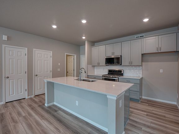 The open-concept kitchen spills into the dining room allowing for an open feel.