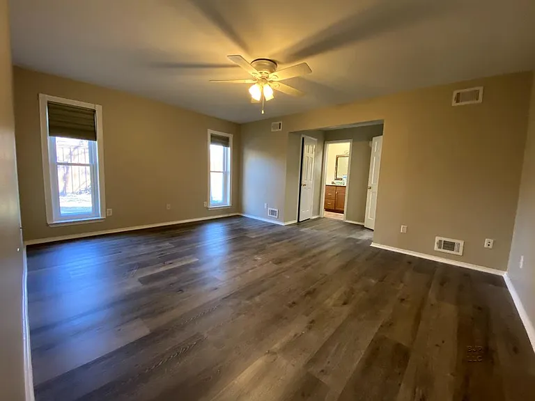 Master bedroom with two walk-in closets