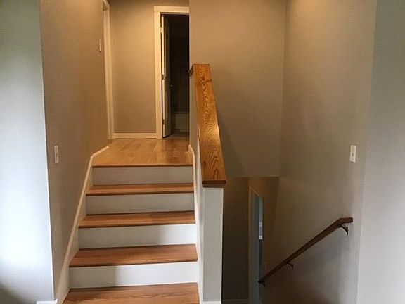 Downstairs goes to laundry room (with .5 bath, two car garage and playroom/basement.