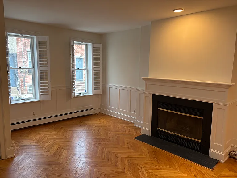 Shutters and wainscoting panels throughout the downstairs.