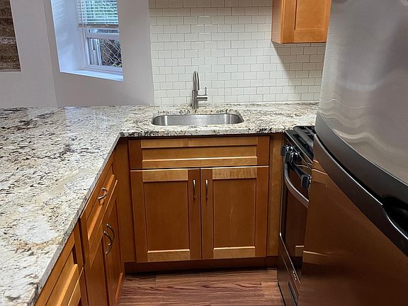Kitchen with granite countertops and stainless appliances.