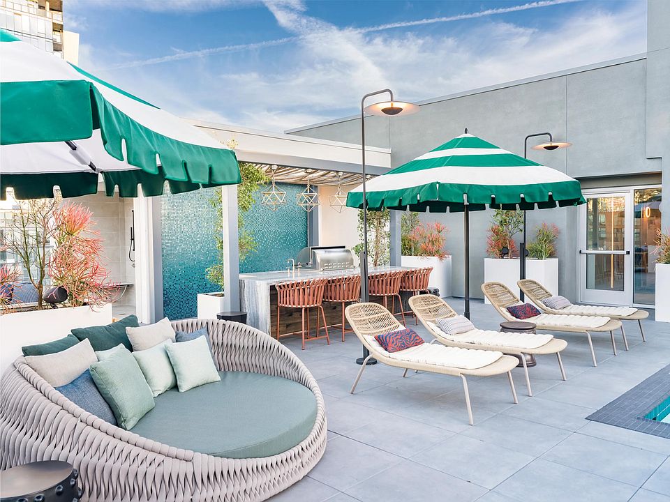 Relax by the pool on comfy daybeds and enjoy shaded areas for ultimate comfort.