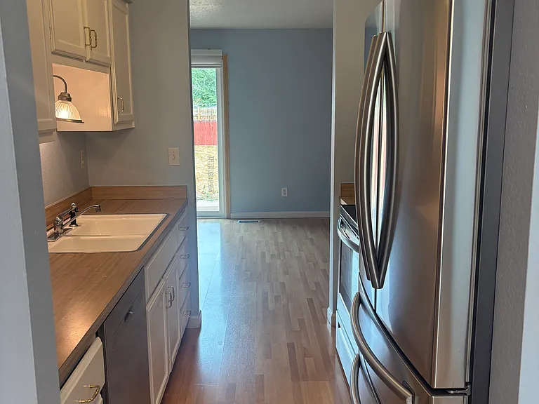 Modern Galley Kitchen with Stainless Steel appliances