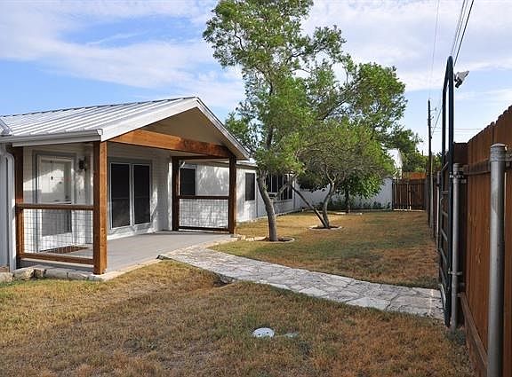 Large front porch and good young trees
