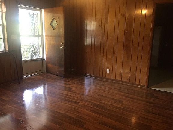 Beautiful hardwood living room with plenty of light.
