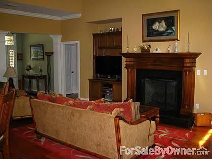 Living Room includes oversized fireplace and entertainment center
