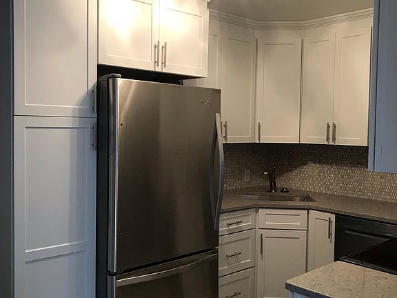 Kitchen with new Kraftmaid cabinets, soft close drawers, stainless steel appliances, grey quartz countertops. Lazy Susan.