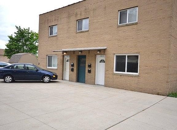 Apartment entrance is in the back of the building