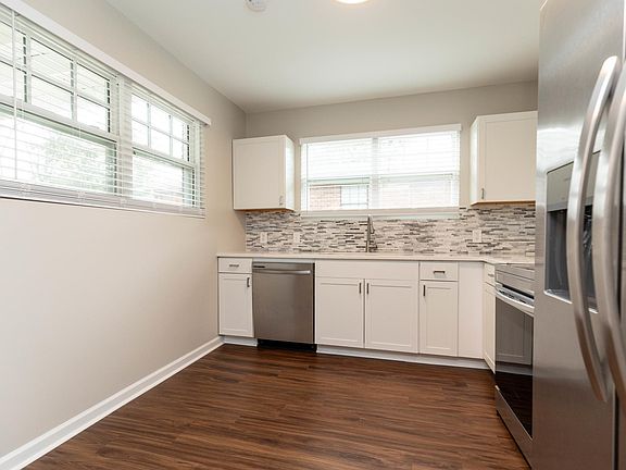Eat in kitchen with windows overlooking covered porch for your morning coffee or evening enjoyment and large backyard.