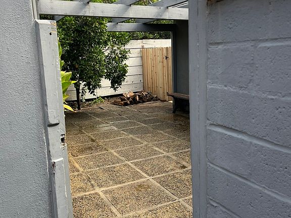 Side gate open to side patio