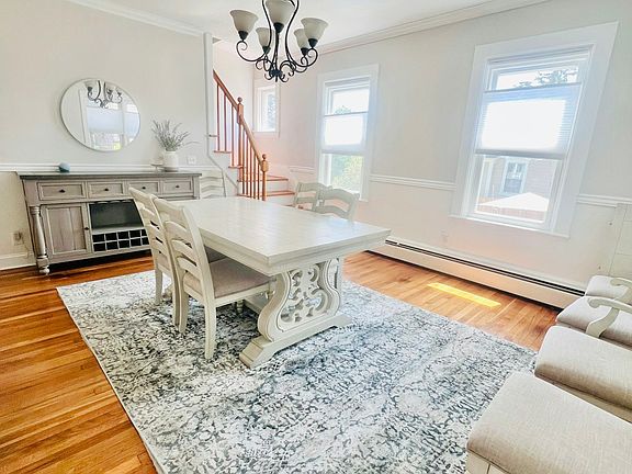 Large dining room with lots of natural light and space to host holidays or just enjoy dinner..