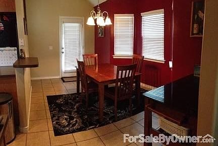 Living room from Kitchen
						:
						Large window gives lots of natural light, ceiling fan, wood laminate flooring