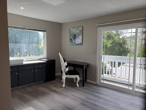 Another side of the room. Small desk with chair and a private mini fridge.
Private granite counter with big washing vessel.