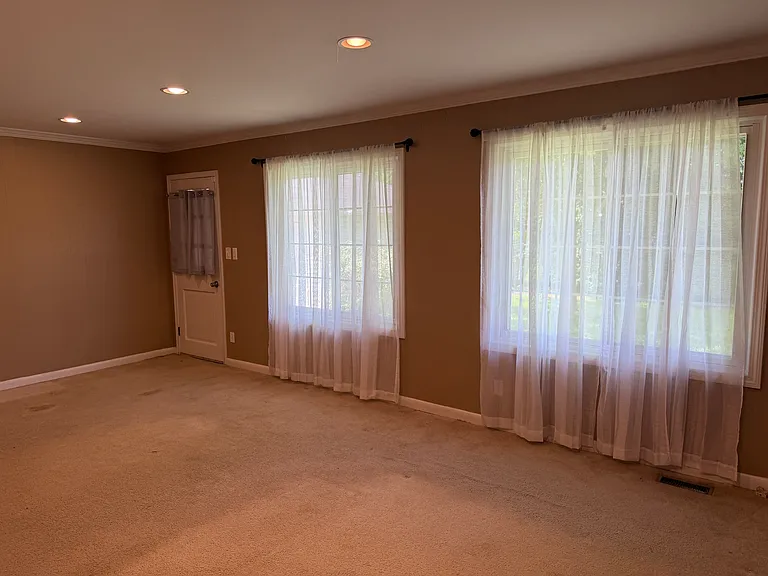 Family room. New flooring will be installed.