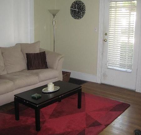 Living Room seen from kitchen door looking at the front door.