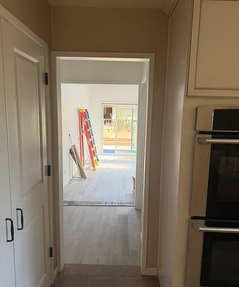 Hallway to back family room from kitchen