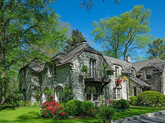 Mature trees surround home
