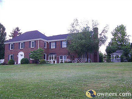 Front of house with spacious front yard with additional side lot