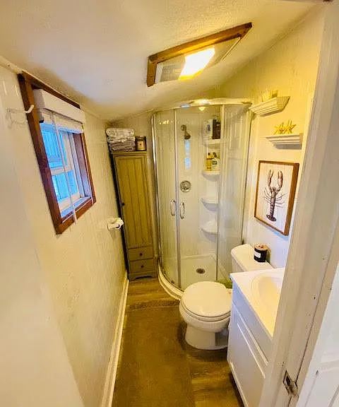 Stand up shower in bathroom.
